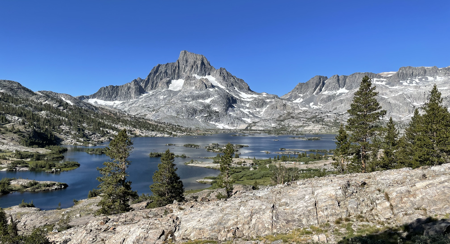 Thousand Island Lake and Sierra Nevada peaks along the John Muir Trail under a clear blue sky